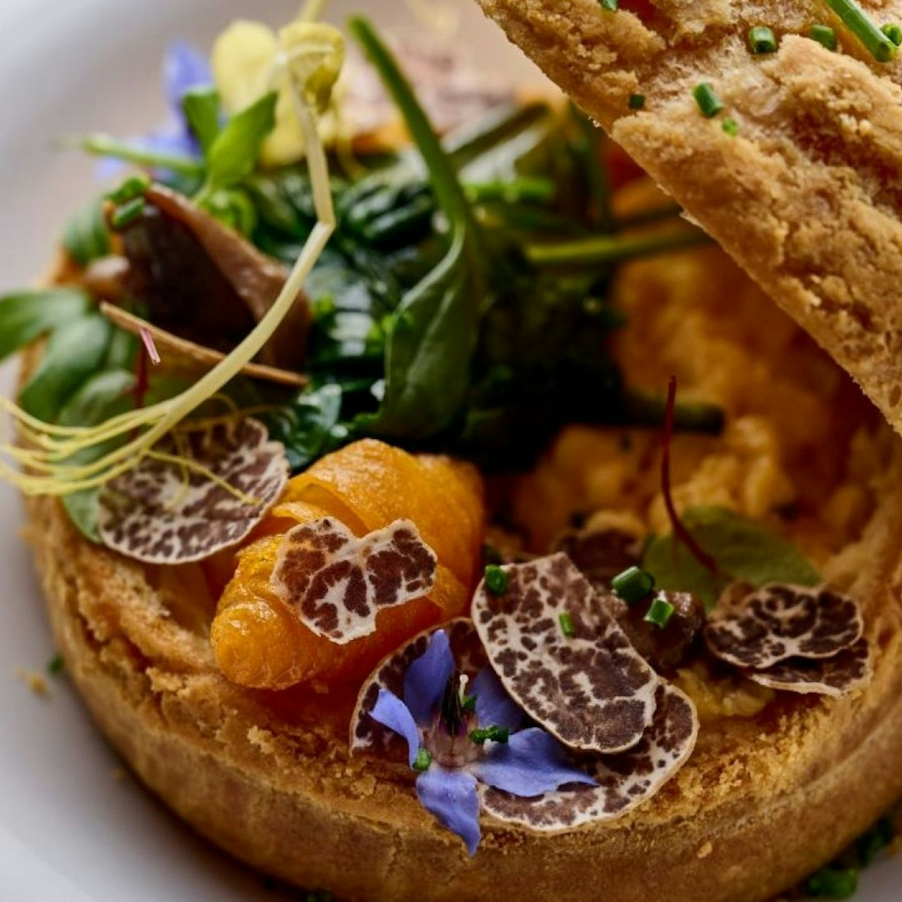 Experience an exceptional three-course afternoon tea in Dubai high above the city where gourmet flavors meet stunning views from the iconic Burj Khalifa’s 122nd floor.